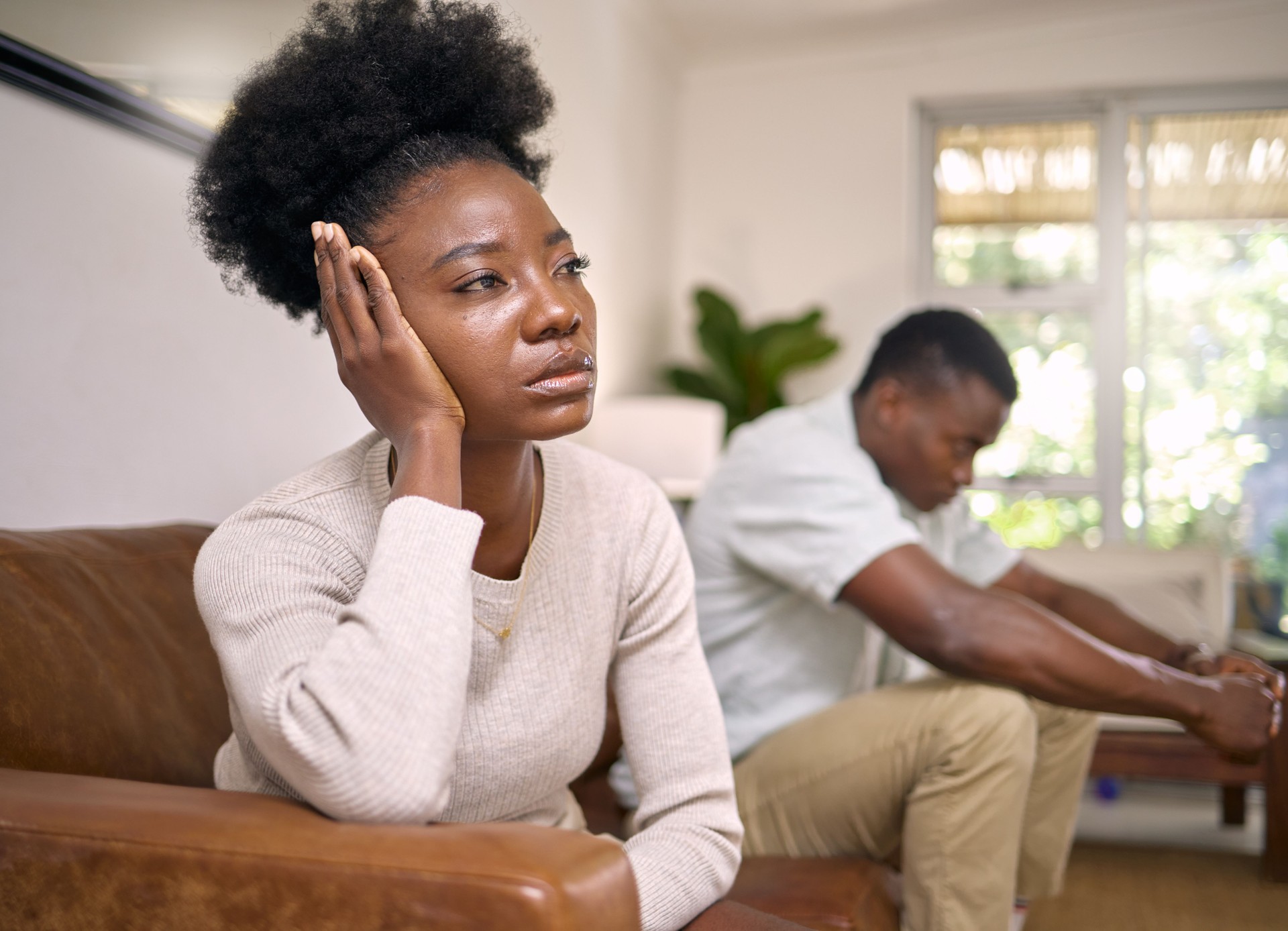 Shot of a young couple in an argument at home