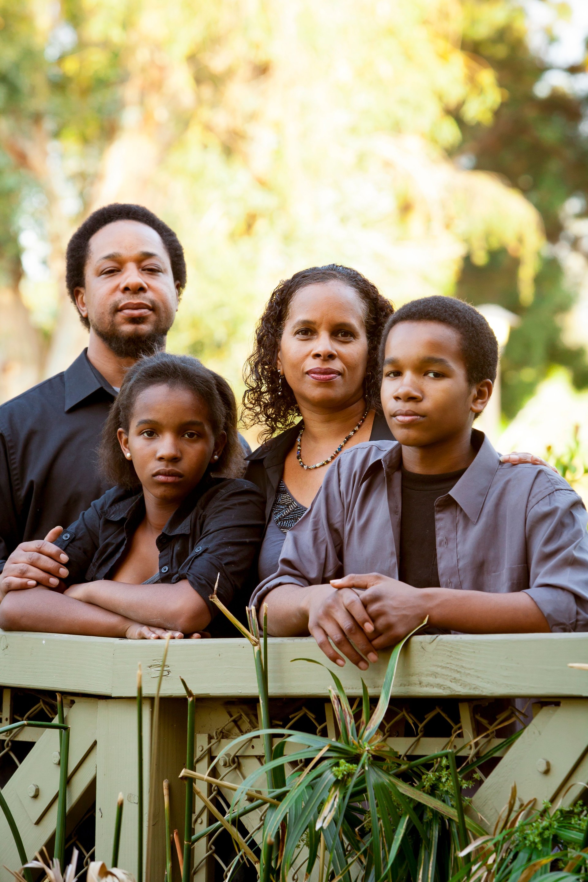 A nuclear family posing for a photograph together